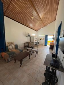 a living room with a couch and a table at Chalés de Triunfo in Triunfo