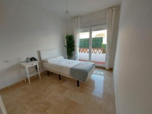 Postel nebo postele na pokoji v ubytování Vivienda adosada agradable y cómoda cerca del mar + 27 fotografií
