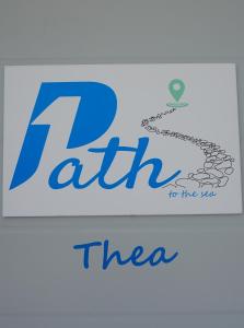 a sign with the text raith to the sea at 1Path Thea Mykonos Super Paradise Beach House in Mýkonos City