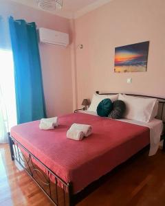 A bed or beds in a room at Sirens Athens Apartment