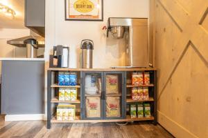 a food cart in a kitchen with food at The Junction Hotel and Hostel in Durango