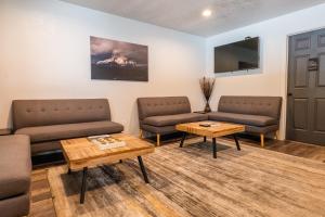 a waiting room with two couches and a table at The Junction Hotel and Hostel in Durango