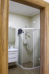 a bathroom with a shower and a sink at Apartman IM7 Međugorje in Međugorje