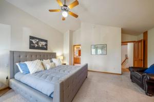 a bedroom with a bed and a ceiling fan at Luxury on Lassen in Sunriver