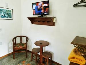 TV a/nebo společenská místnost v ubytování Pousada Rumo dos Ventos