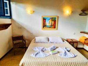 Postel nebo postele na pokoji v ubytování Pousada Rumo dos Ventos