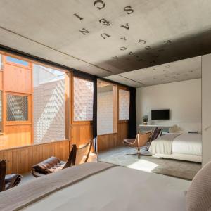 Un ou plusieurs lits dans un hébergement de l'établissement Hotel Tipografia do Conto by Casa do Conto