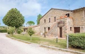 an old stone house with a road in front of it at Awesome Apartment In Magione With Wifi in Magione