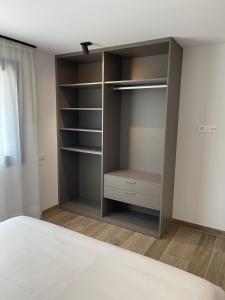 Postel nebo postele na pokoji v ubytování APARTAMENTOS TURÍSTICOS EL RINCONÍN + 37 fotografií
