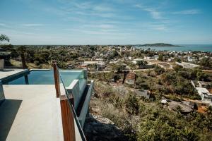 a view of a city from the balcony of a house at Terraço in Guarapari