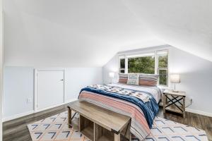 a bedroom with a bed and a window at Sea Esta in Fort Bragg