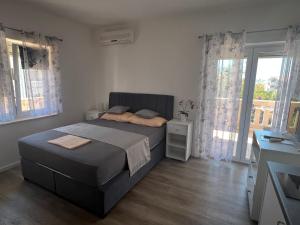 Postel nebo postele na pokoji v ubytování Apartments Villa Zdrava