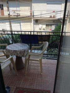 a table and chairs on a balcony with a table at Guest House Ohrid Trpeski in Ohrid