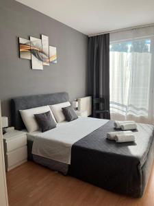 Postel nebo postele na pokoji v ubytování VIP MINI RESORT,Private Parking & Balcony