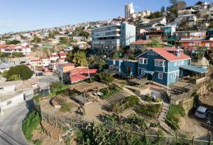 an aerial view of a city with a blue house at Hotel Faro Azul Valparaíso Cerro Alegre in Valparaíso