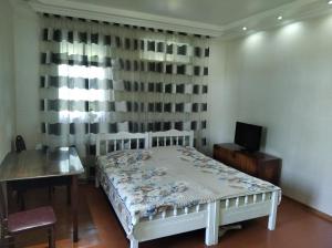 a bedroom with a white bed and a window at Roin Guest House in Grigoleti +16 photos