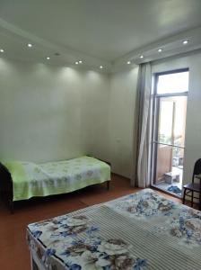 Postel nebo postele na pokoji v ubytování Roin Guest House