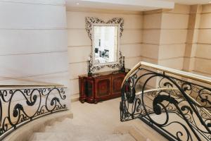 a staircase in a house with a mirror and a mirror at DiplomaticHotel in Mendoza