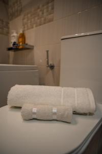 a towel sitting on top of a counter in a bathroom at Zoes Luxury Apartment Corfu in Agios Rokkos