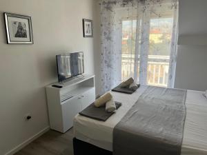 Postel nebo postele na pokoji v ubytování Apartments Villa Zdrava
