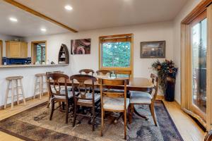 a kitchen and dining room with a table and chairs at Kobza's Quandary View in Breckenridge