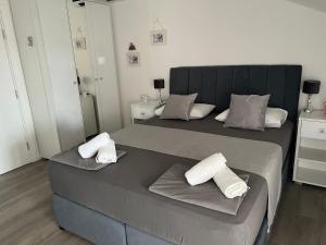 Postel nebo postele na pokoji v ubytování Apartments Villa Zdrava