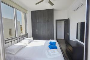 Ένα ή περισσότερα κρεβάτια σε δωμάτιο στο Protaras Pearl Villa Ekaterina