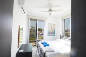 Ένα ή περισσότερα κρεβάτια σε δωμάτιο στο Protaras Pearl Villa Ekaterina