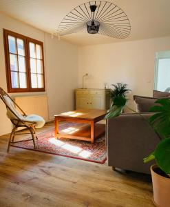 a living room with a couch and a coffee table at The Gate House & Winery in Santenay