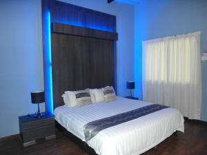 Katil atau katil-katil dalam bilik di Casa Fina Fine Homes