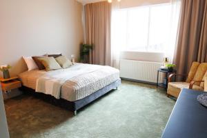 Rúm í herbergi á Hotel Kaldi
