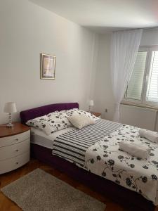 Posteľ alebo postele v izbe v ubytovaní Apartment Tina