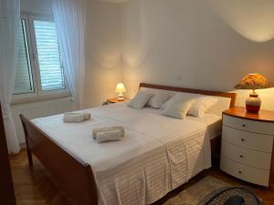 Posteľ alebo postele v izbe v ubytovaní Apartment Tina
