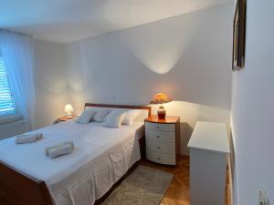 Posteľ alebo postele v izbe v ubytovaní Apartment Tina