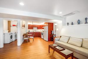 a living room with a couch and a table at Forest Bay House Apartment in Port Townsend