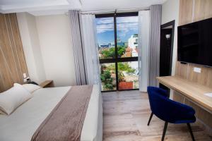Postel nebo postele na pokoji v ubytování Hotel Sirari By Regina