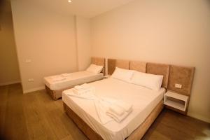 Postel nebo postele na pokoji v ubytování Solea Hotel