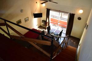 a living room with a couch and a window at Jucaso Departamentos in San Pedro