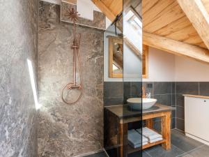 a bathroom with a shower and a sink at AlmApARTment Mauterndorf Pichl 9-4 in Mauterndorf +25 photos