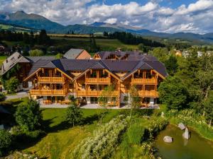 an overhead view of a large log home with a roof at AlmApARTment Mauterndorf Pichl 9-4 in Mauterndorf
