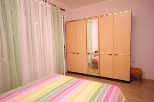 Postel nebo postele na pokoji v ubytování Apartment Supetarska Draga - Donja 2013b
