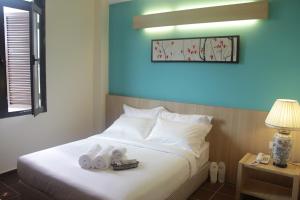 Postel nebo postele na pokoji v ubytování Fomecs Boutique Hotel, Jonker Street