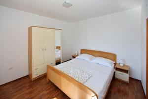 Postel nebo postele na pokoji v ubytování Apartment Bibinje 4197b