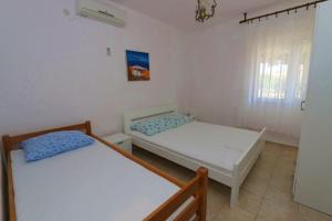 Postel nebo postele na pokoji v ubytování Apartment Kustici 4086d