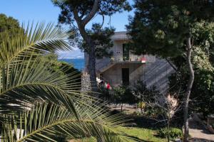 a house with a view of the ocean at Family friendly seaside apartments Slatine, Ciovo - 1096 in Slatine