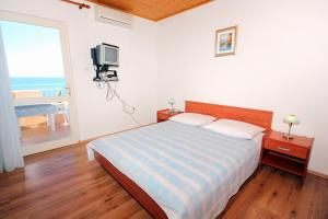 Posteľ alebo postele v izbe v ubytovaní Studio Mandre 3557a