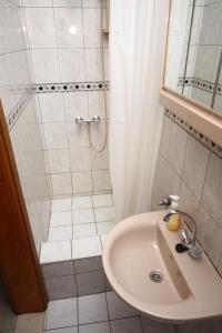 a bathroom with a sink and a shower at Apartments and rooms by the sea Slano, Dubrovnik - 2178 in Slano