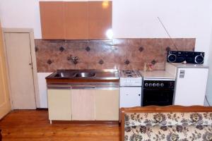 a kitchen with a sink and a stove at Apartments with a parking space Vrisnik, Hvar - 4051 in Jelsa