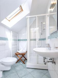 a white bathroom with a sink and a toilet at Studio Zavala 2061a in Zavala