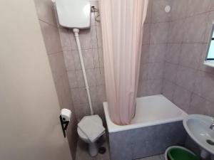 a small bathroom with a shower and a sink at Apartments with a parking space Jelsa, Hvar - 2059 in Jelsa